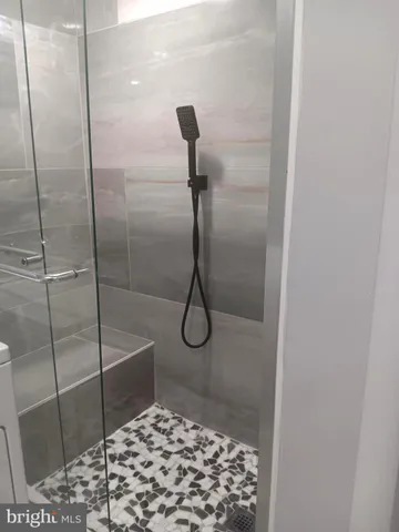 a bathroom with a sink toilet and a mirror