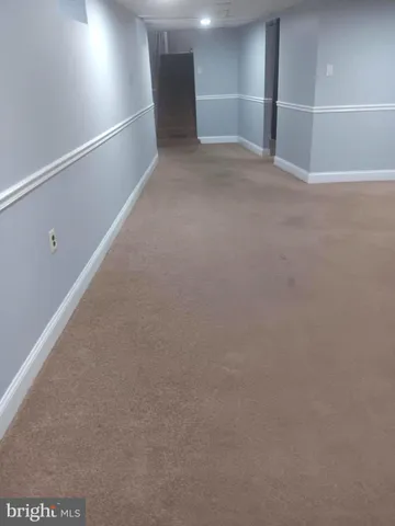 a view of a backyard with large trees