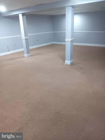 a view of outdoor space with playground and green space