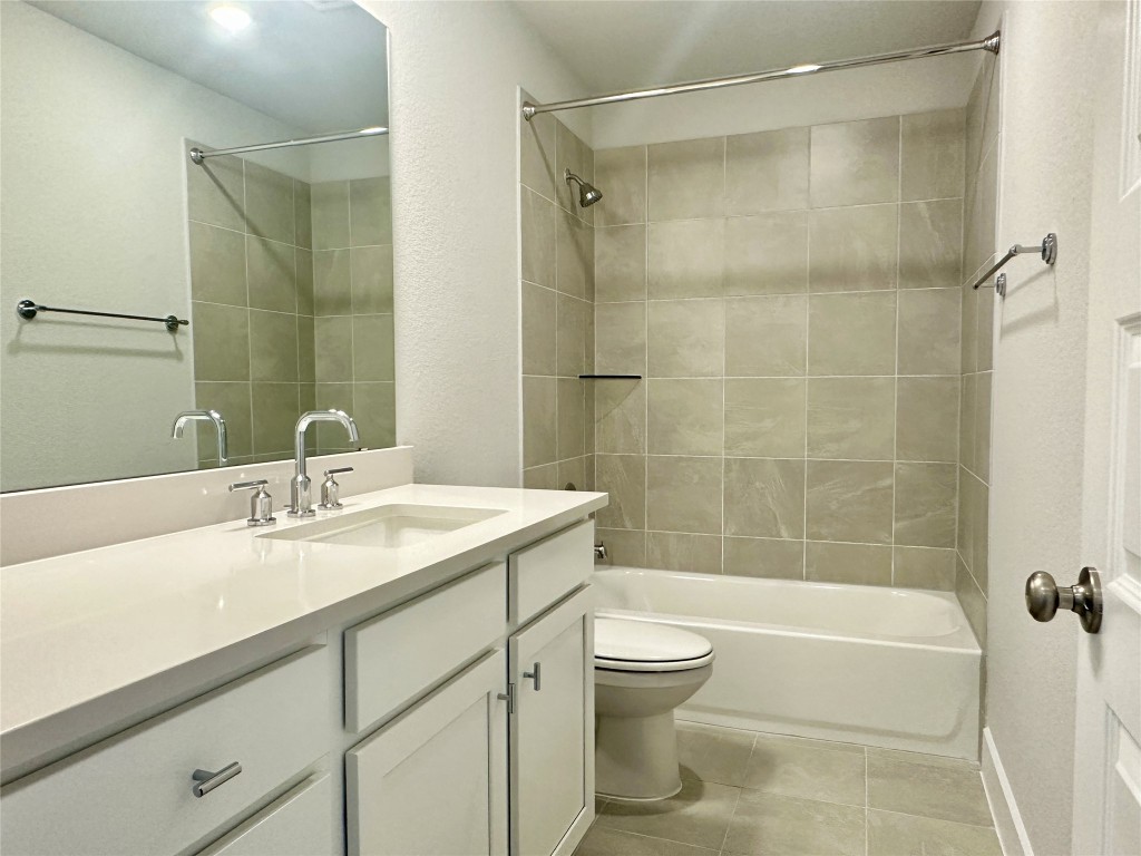 111 Pinyon Pne Drive Bastrop, TX 78602 - Photo 13 of 16 a bathroom with a sink a toilet and shower