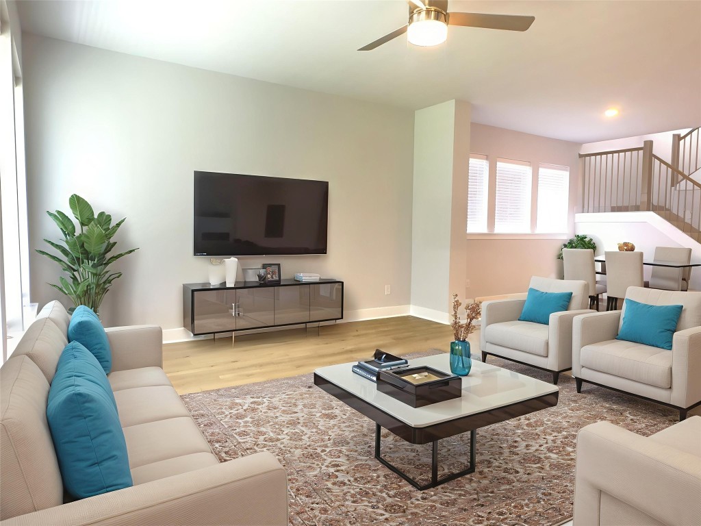 111 Pinyon Pne Drive Bastrop, TX 78602 - Photo 4 of 16 a living room with furniture a flat screen tv and a large window