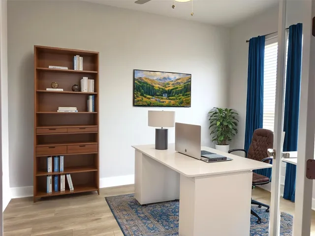 a room with furniture and a potted plant