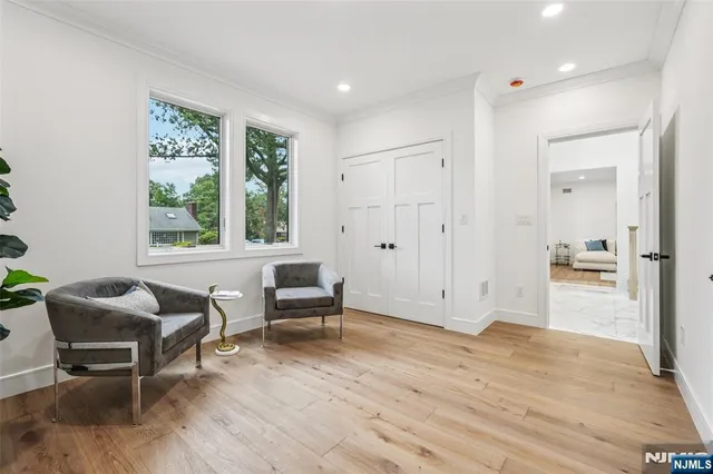 a view of a livingroom with furniture window and wooden floor