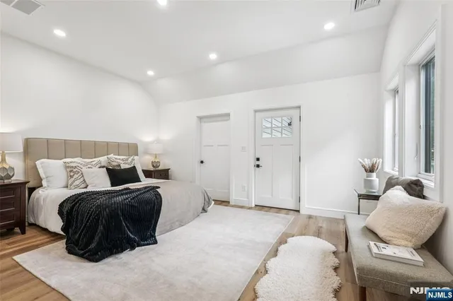 a bedroom with a bed and window