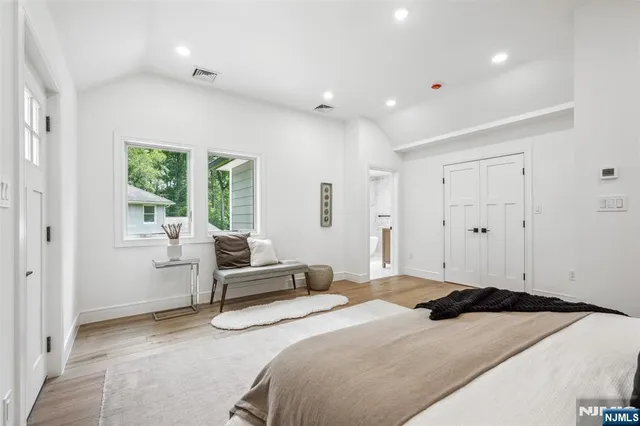 a bedroom with a bed and furniture