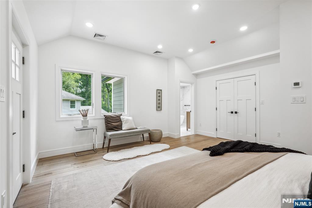 492 Oaktree Road Oradell, NJ 07649 - Photo 20 of 43 a bedroom with a bed and furniture