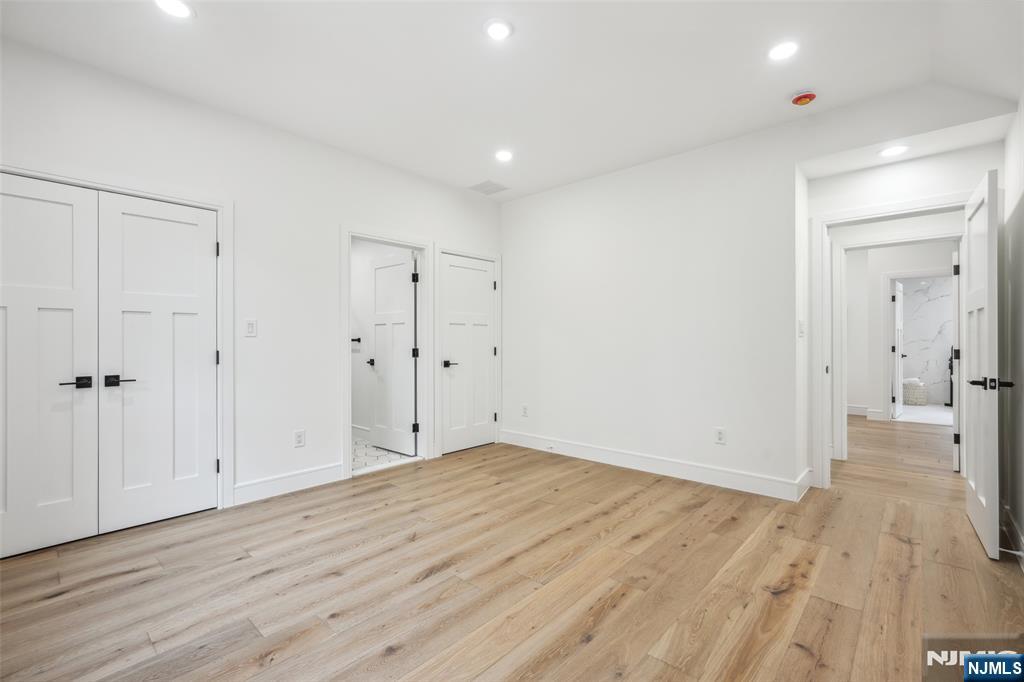 492 Oaktree Road Oradell, NJ 07649 - Photo 25 of 43 an empty room with wooden floor