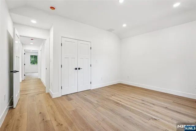 an empty room with wooden floor
