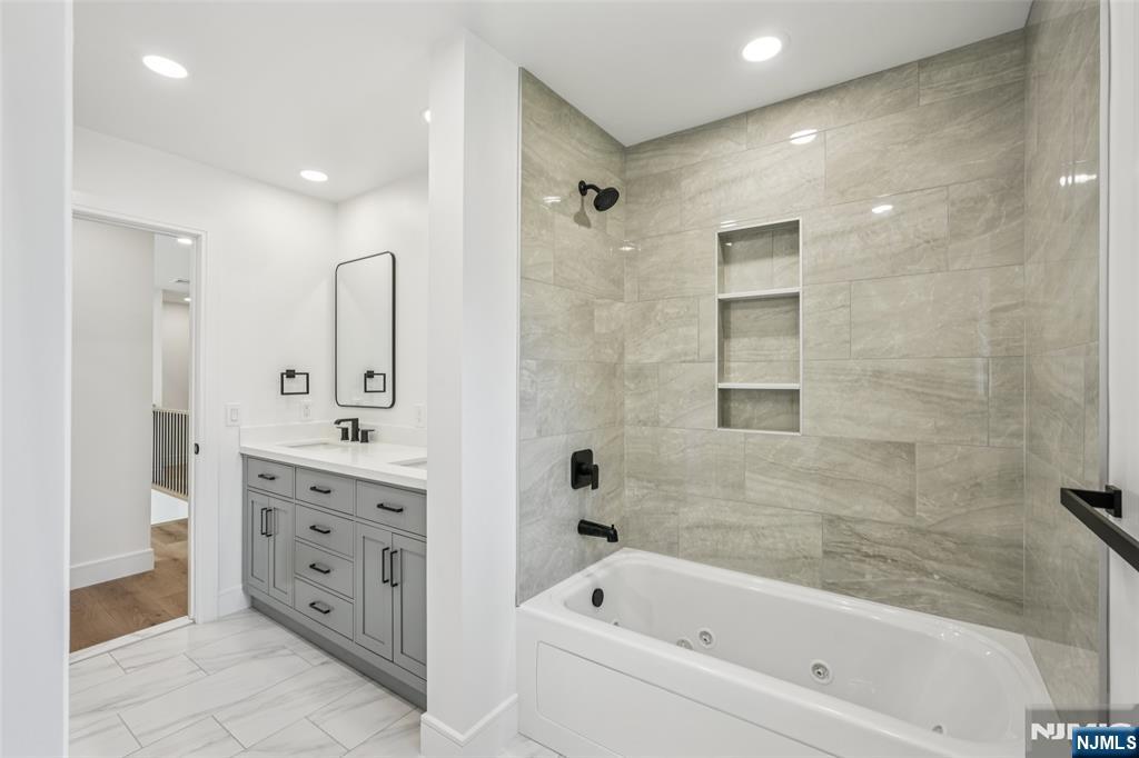 492 Oaktree Road Oradell, NJ 07649 - Photo 29 of 43 a bathroom with a bathtub shower sink and toilet