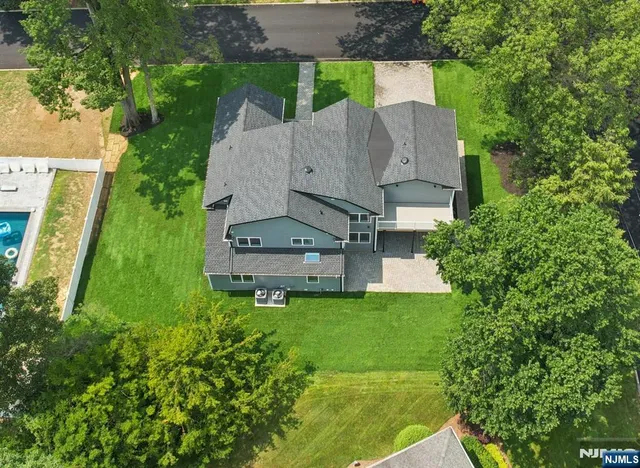 an aerial view of a house with a garden