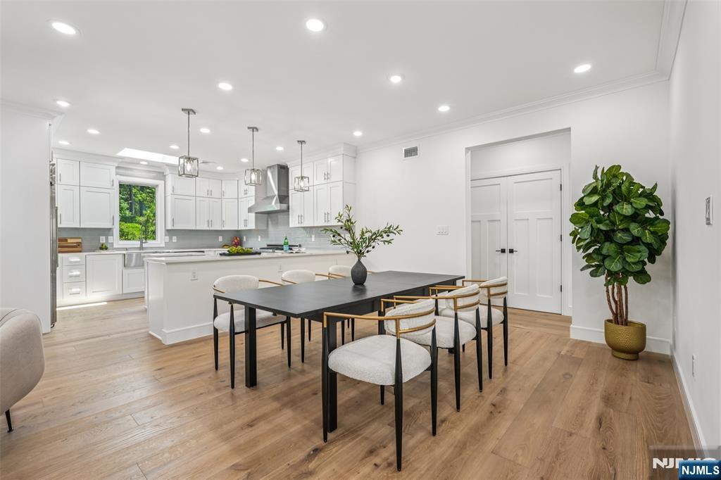 492 Oaktree Road Oradell, NJ 07649 - Photo 6 of 43 a kitchen with a table and chairs in it