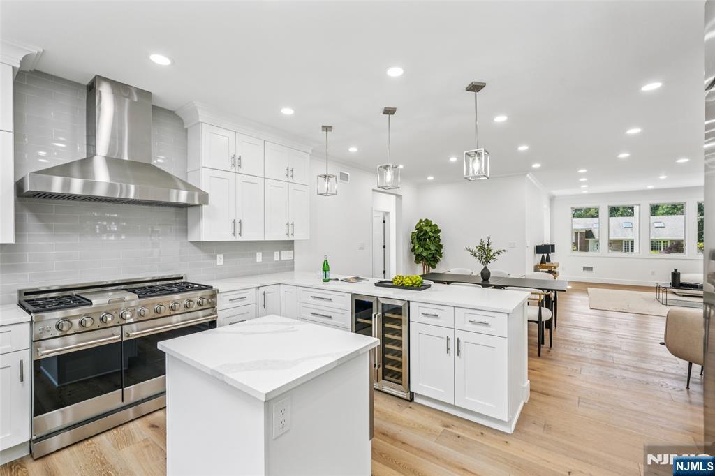 492 Oaktree Road Oradell, NJ 07649 - Photo 7 of 43 a kitchen with a stove a sink and a refrigerator