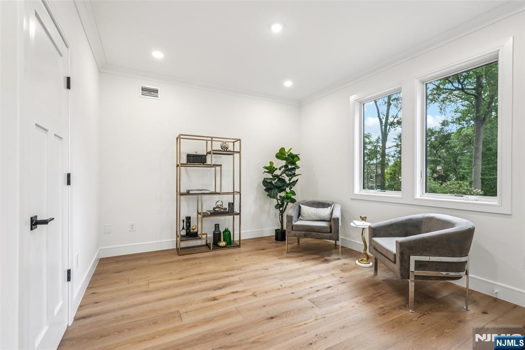 492 Oaktree Road Oradell, NJ 07649 - Photo 10 of 43 a living room with furniture and a wooden floor