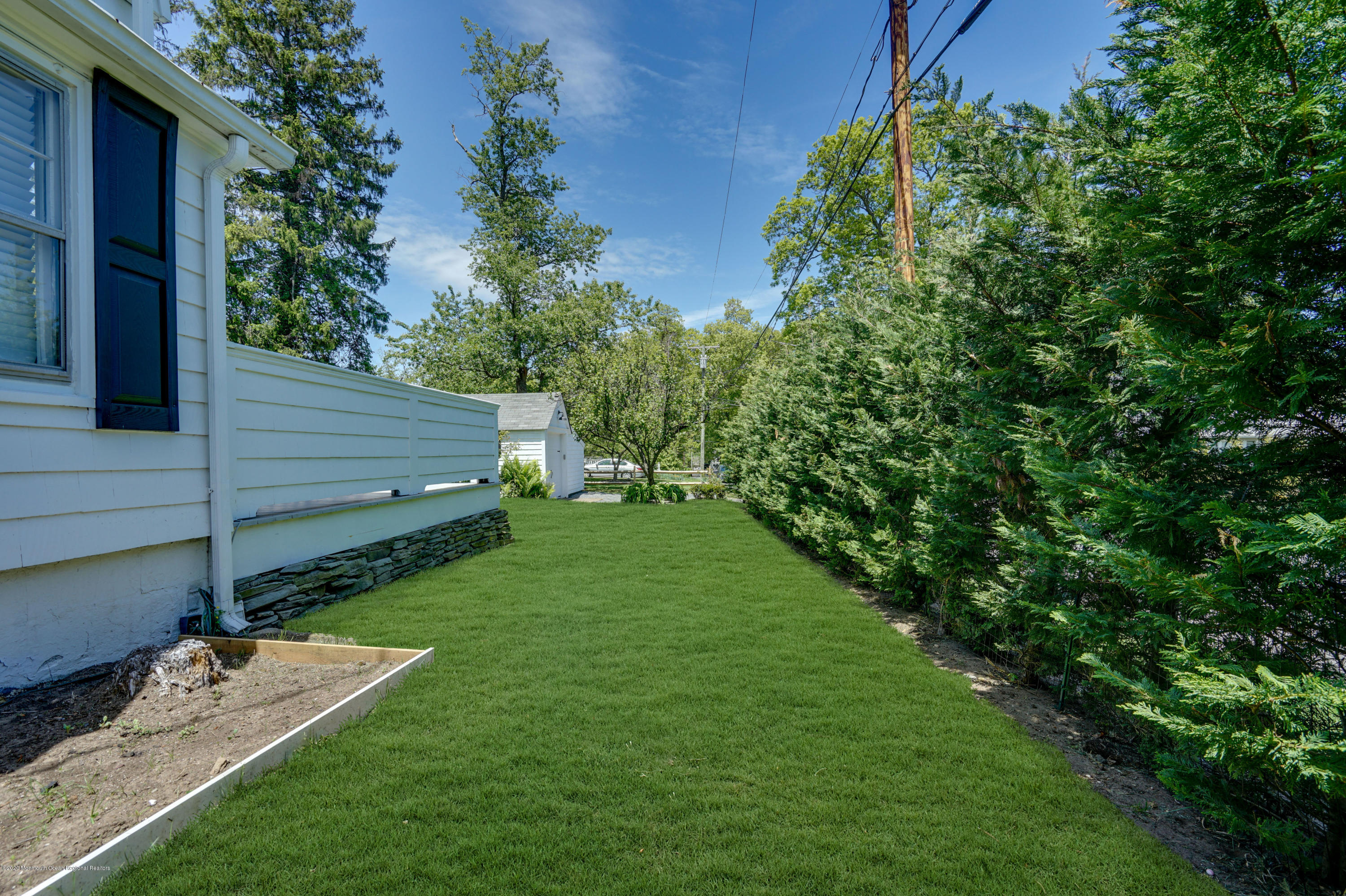 74 Black Point Road Rumson, NJ 07760 - Photo 34 of 36 a view of a backyard with sitting area