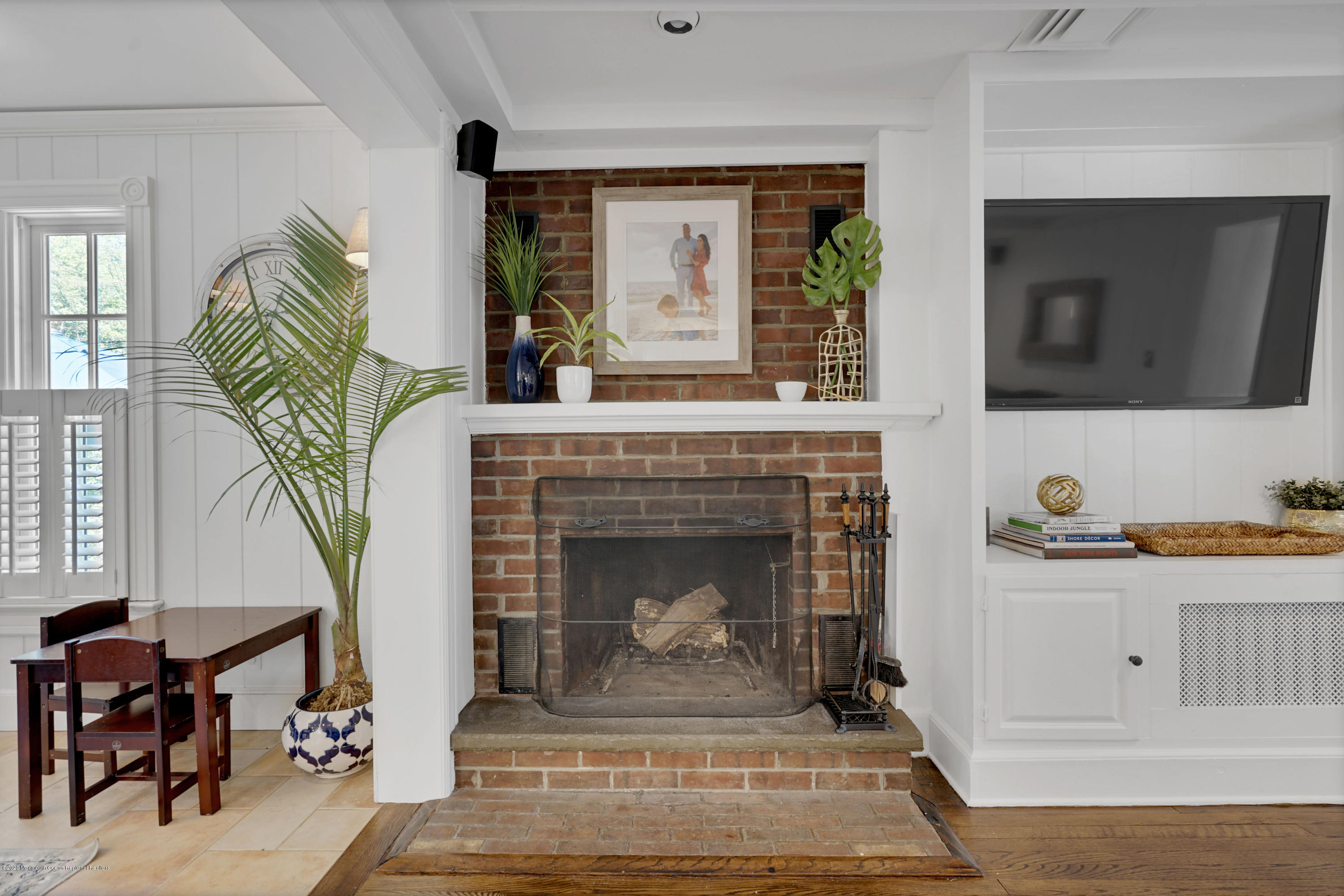 74 Black Point Road Rumson, NJ 07760 - Photo 8 of 36 a living room with furniture and a fireplace