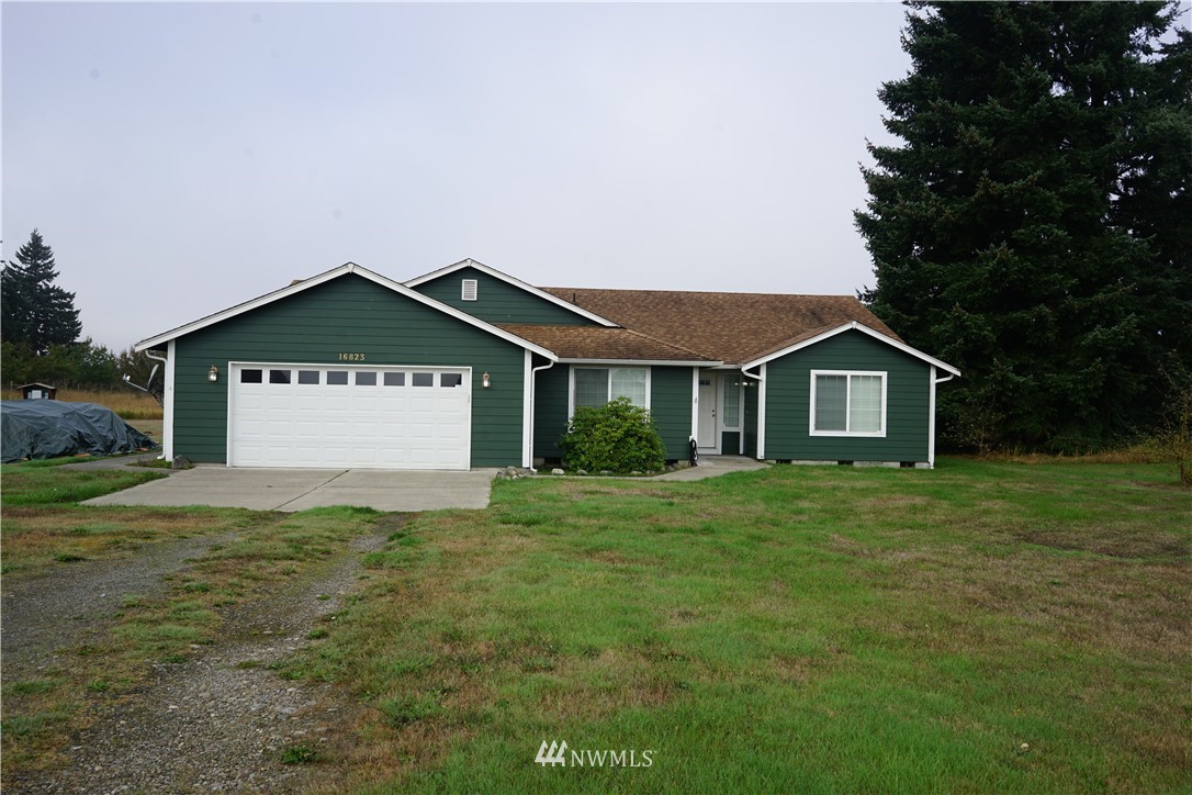 16823 Leitner Road Southwest Rochester, WA 98579 - Photo 1 of 31 a view of a house with a yard