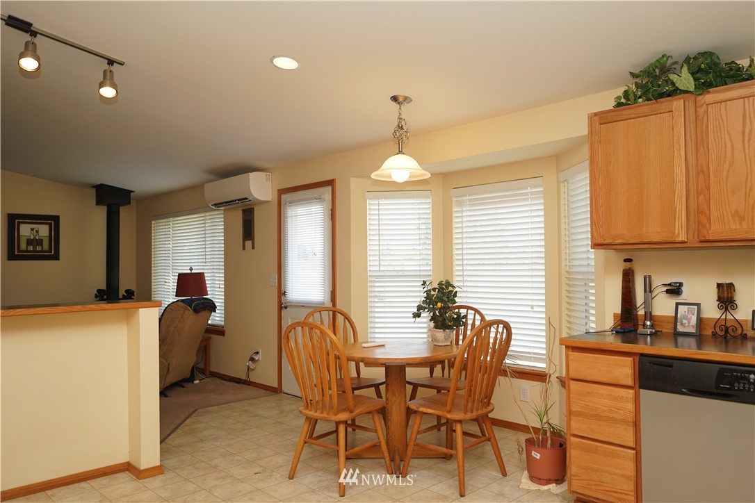 16823 Leitner Road Southwest Rochester, WA 98579 - Photo 12 of 31 a dining room with furniture and window