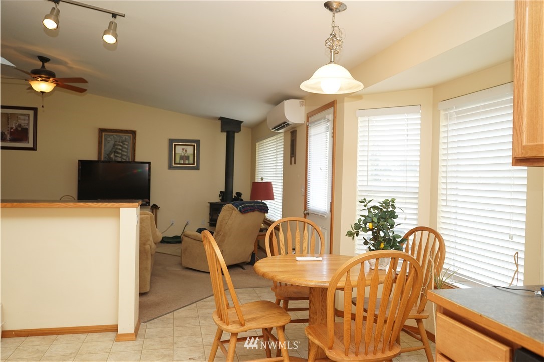 16823 Leitner Road Southwest Rochester, WA 98579 - Photo 15 of 31 a dining room with furniture and window