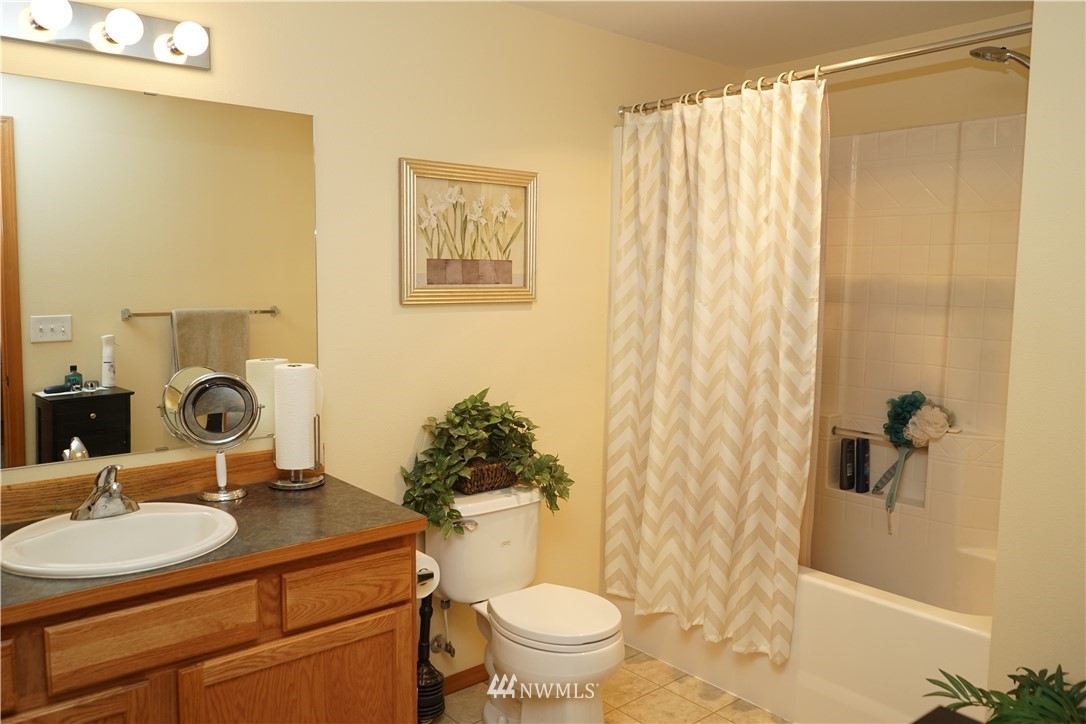 16823 Leitner Road Southwest Rochester, WA 98579 - Photo 20 of 31 a bathroom with a sink toilet and shower