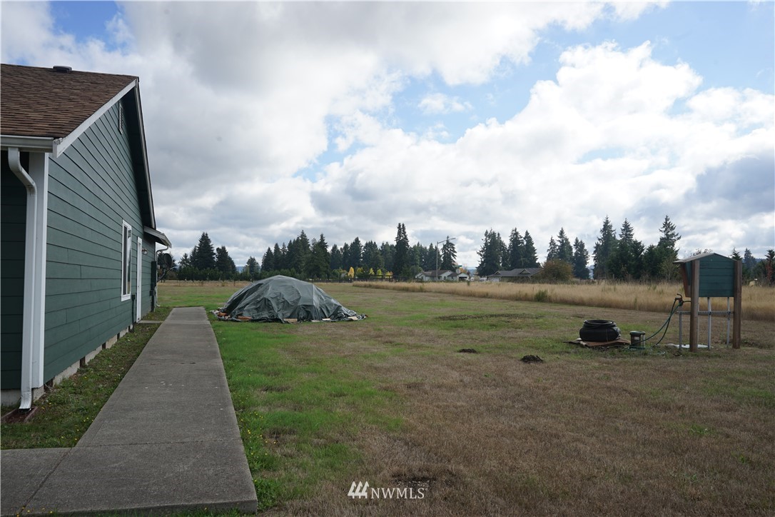 16823 Leitner Road Southwest Rochester, WA 98579 - Photo 3 of 31 a view of a garden with wooden deck