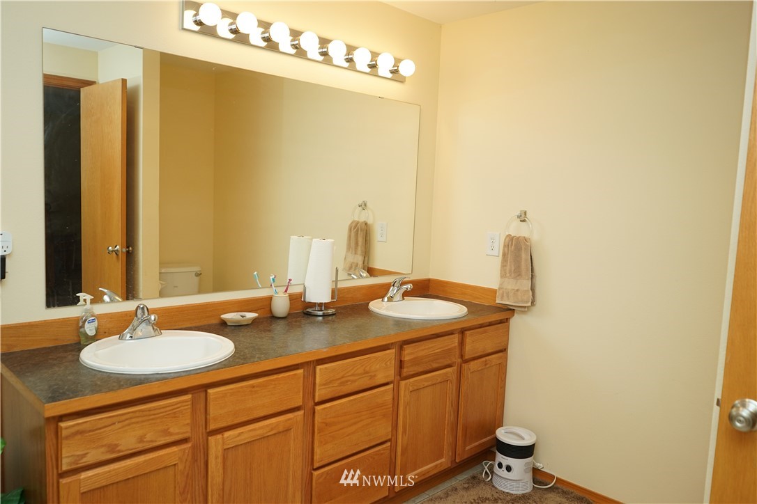 16823 Leitner Road Southwest Rochester, WA 98579 - Photo 26 of 31 a bathroom with a sink and a mirror