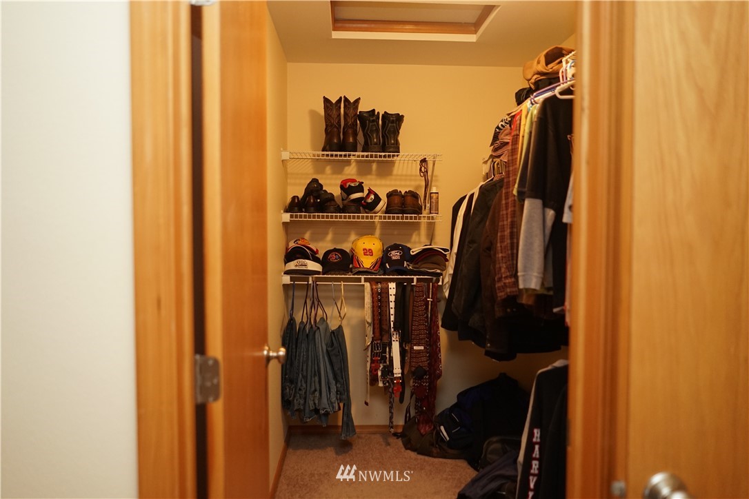 16823 Leitner Road Southwest Rochester, WA 98579 - Photo 27 of 31 a view of walk in closet with clothes and shoes