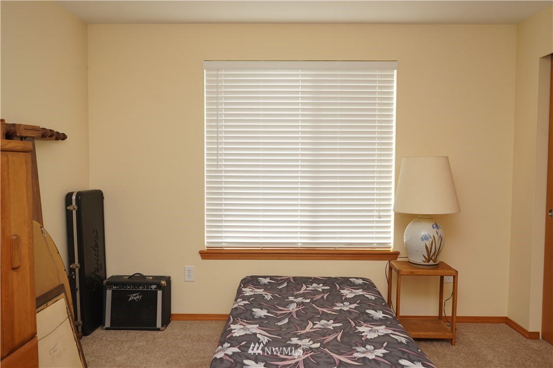 16823 Leitner Road Southwest Rochester, WA 98579 - Photo 28 of 31 a bedroom with a bed and a tv