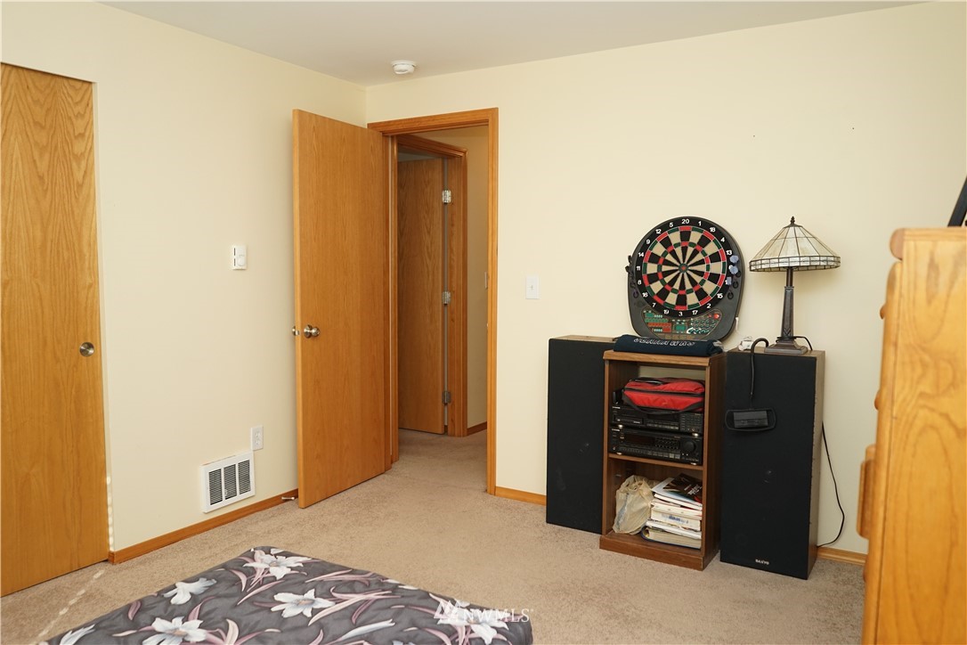 16823 Leitner Road Southwest Rochester, WA 98579 - Photo 29 of 31 a view of a dresser with wooden floor