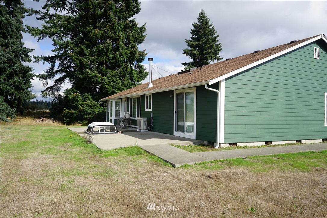 16823 Leitner Road Southwest Rochester, WA 98579 - Photo 5 of 31 a view of a house with backyard and sitting area
