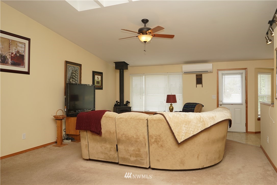 16823 Leitner Road Southwest Rochester, WA 98579 - Photo 9 of 31 a bedroom with a bed and window