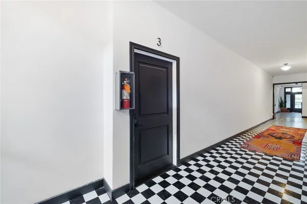 a bedroom with a bed and cabinets