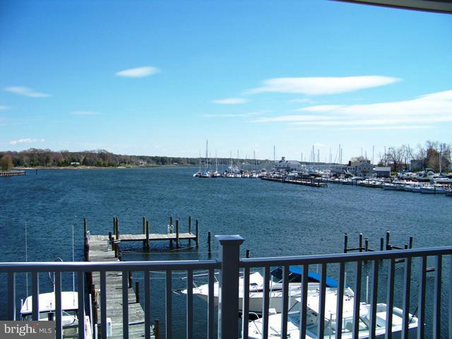 14642 Solomons Island Road South, Unit 2 Solomons, MD 20688 - Photo 14 of 14 a view of a lake with a mountain view