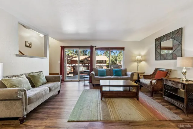 a living room with furniture and a rug
