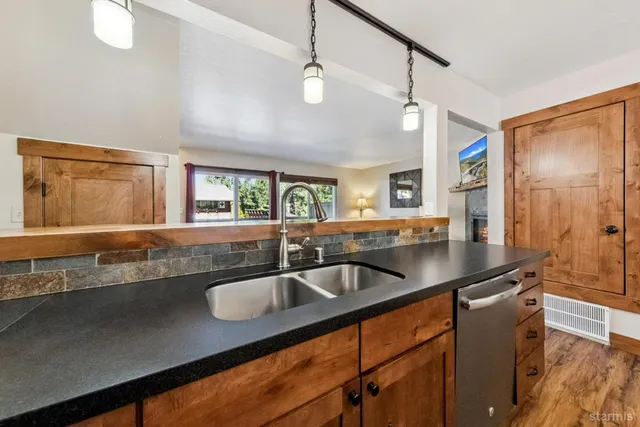 a kitchen with a sink and a refrigerator