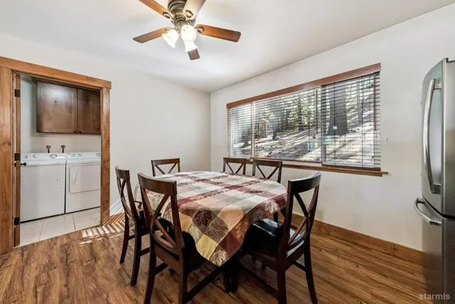 a dining room with furniture and window