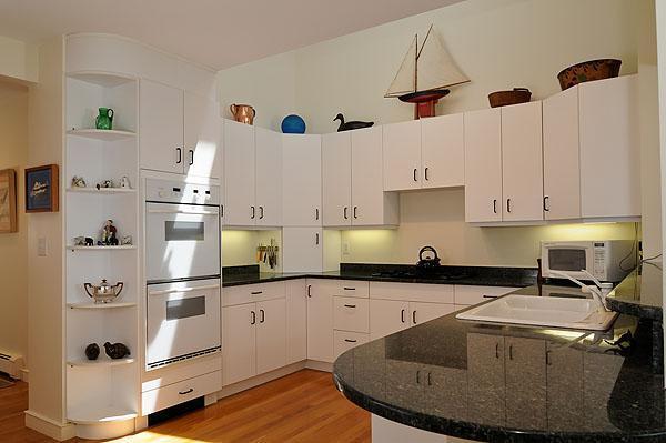 48 Bourne Point Road Wareham, MA 02571 - Photo 12 of 23 a kitchen with stainless steel appliances granite countertop a sink a stove and refrigerator