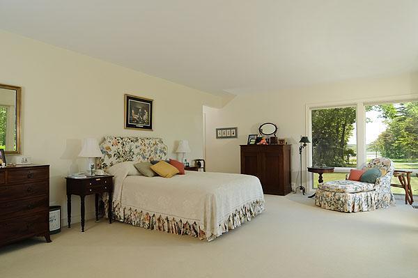 48 Bourne Point Road Wareham, MA 02571 - Photo 14 of 23 a bedroom with a bed and wooden floor