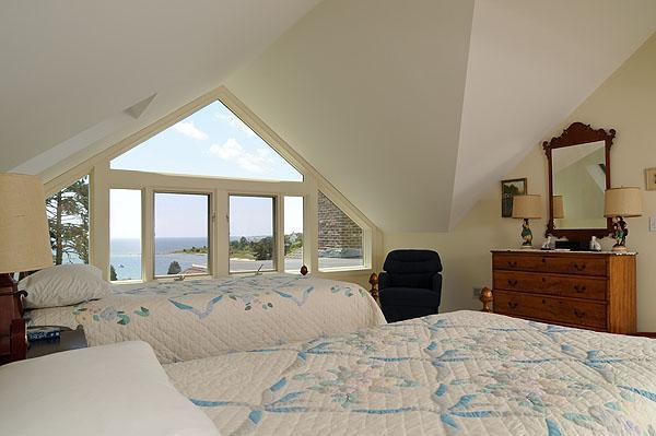 48 Bourne Point Road Wareham, MA 02571 - Photo 17 of 23 a bedroom with a large bed and a large window