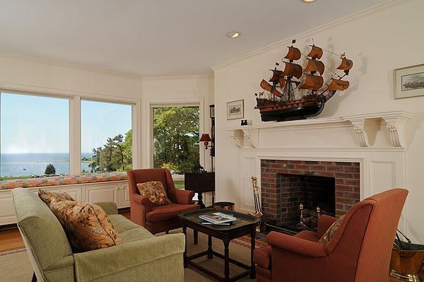 48 Bourne Point Road Wareham, MA 02571 - Photo 6 of 23 a living room with furniture and a fireplace