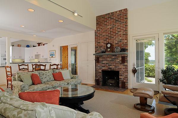 48 Bourne Point Road Wareham, MA 02571 - Photo 9 of 23 a living room with furniture and a fireplace