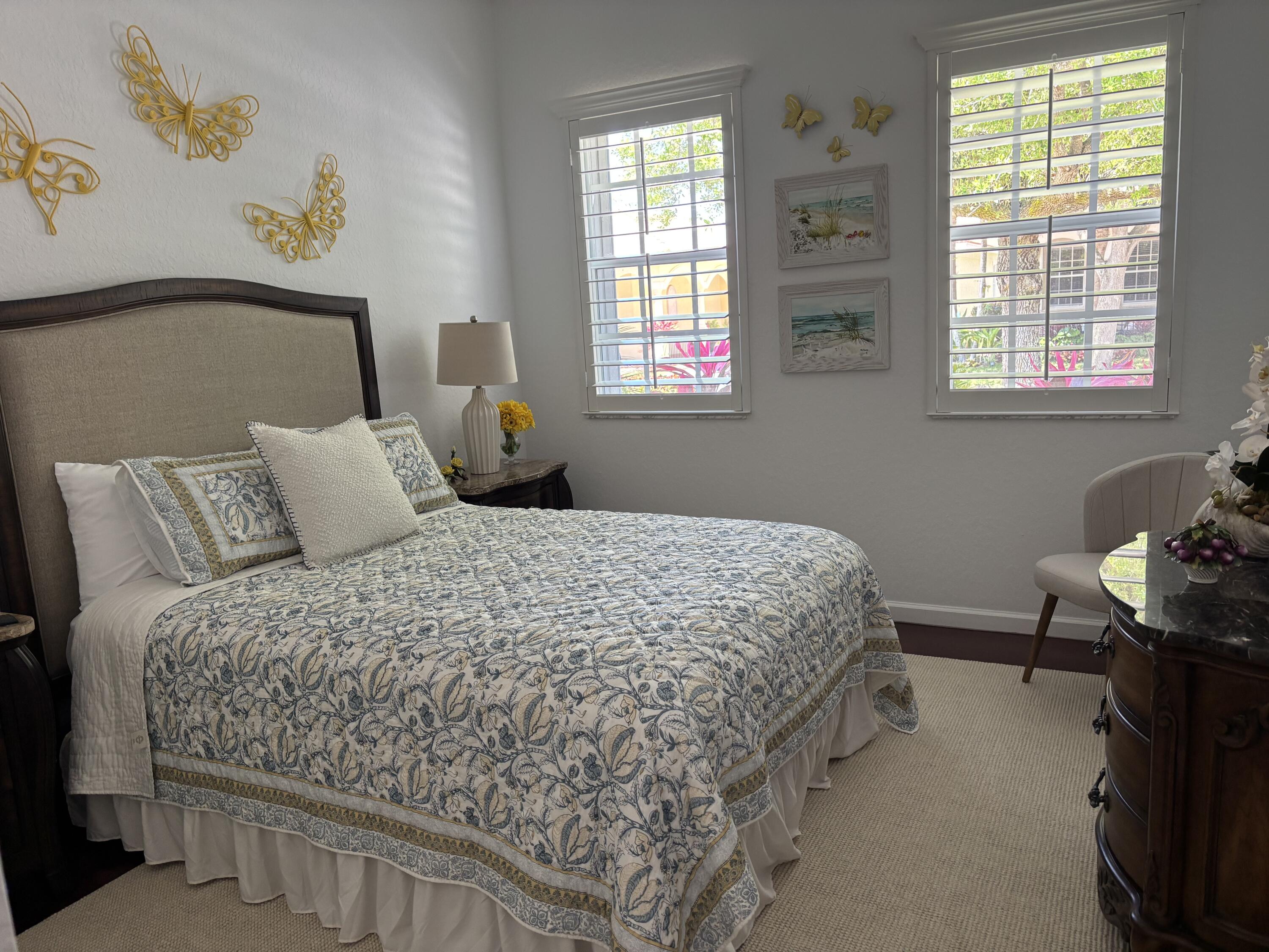 140 Via Rosina Jupiter, FL 33458 - Photo 13 of 16 a bedroom with a bed and window