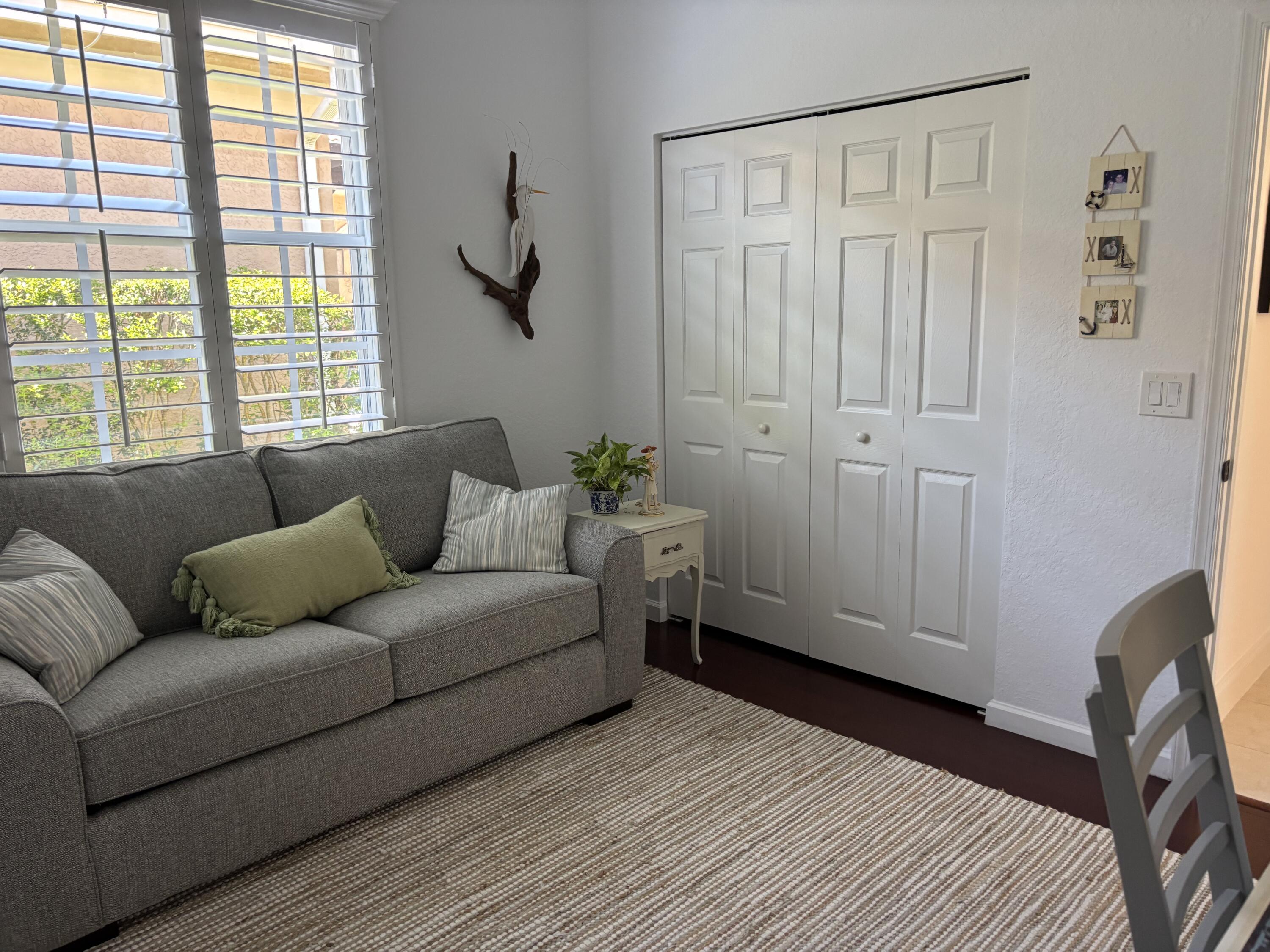 140 Via Rosina Jupiter, FL 33458 - Photo 15 of 16 a living room with furniture and a window
