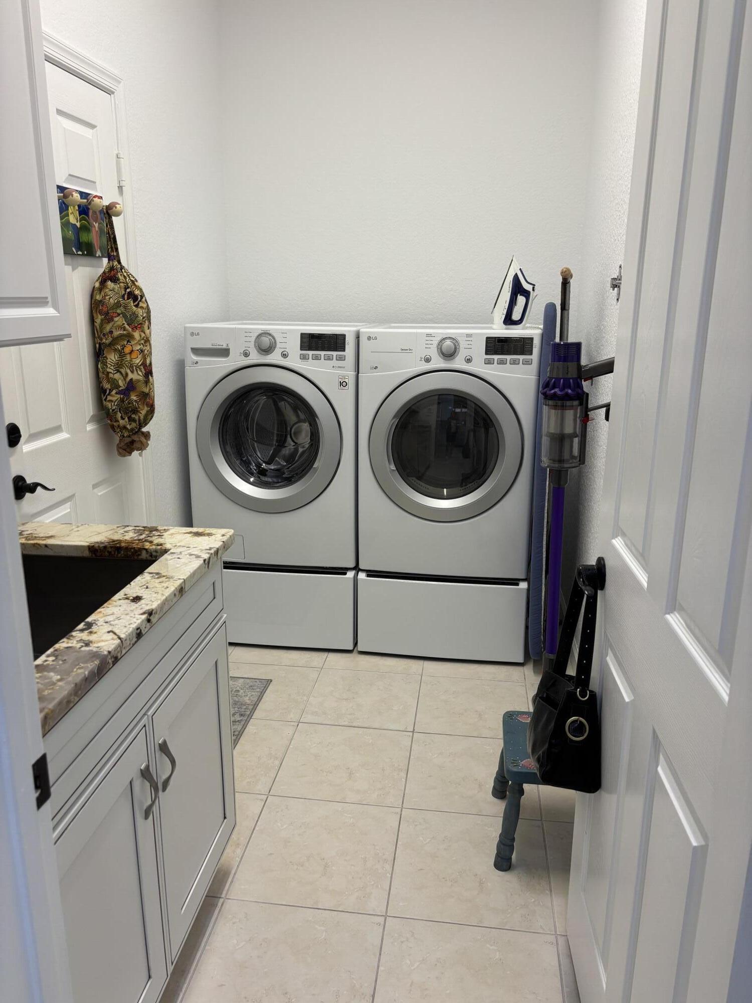140 Via Rosina Jupiter, FL 33458 - Photo 16 of 16 a utility room with dryer and washer