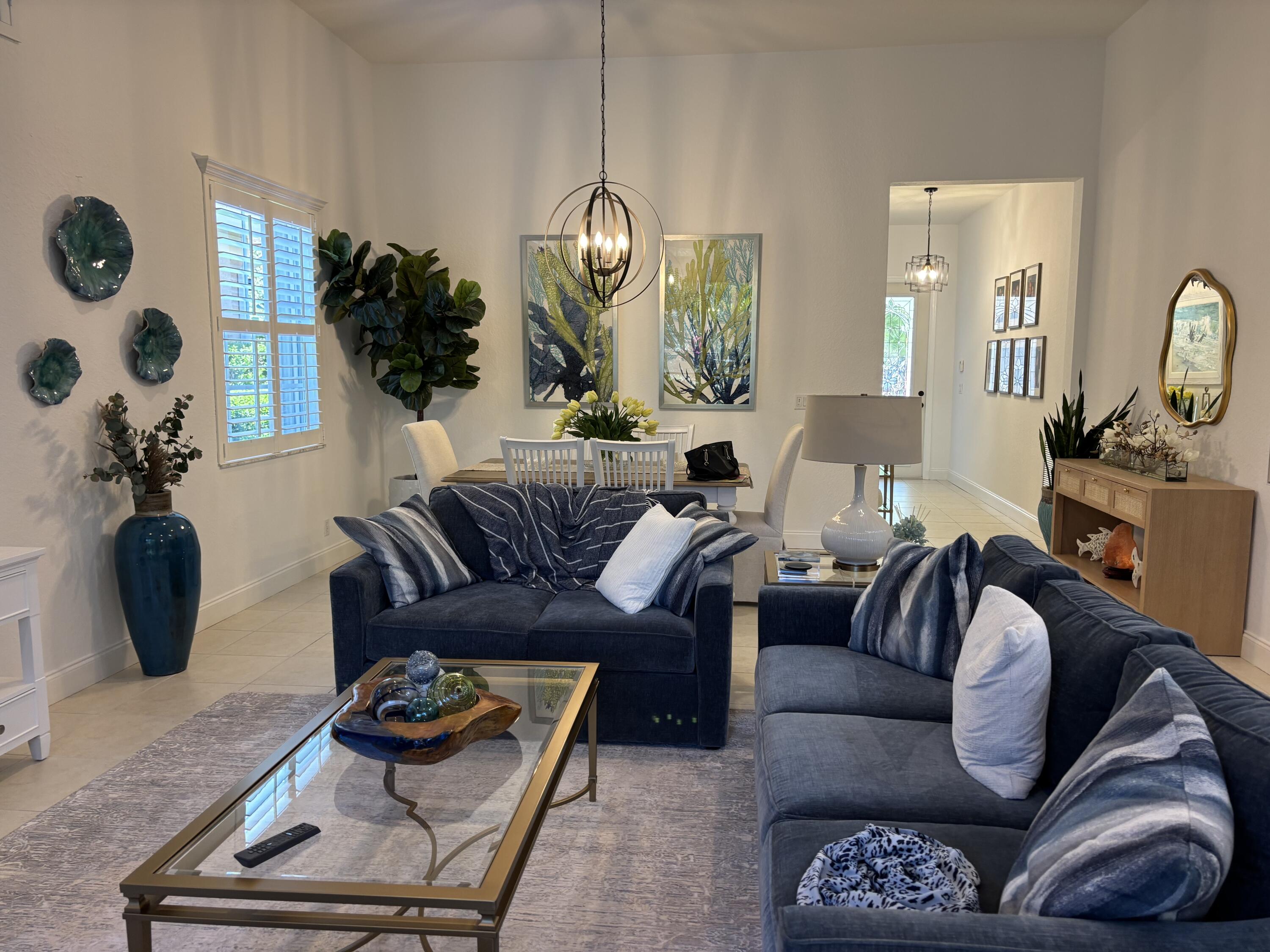 140 Via Rosina Jupiter, FL 33458 - Photo 2 of 16 a living room with furniture a rug and a window