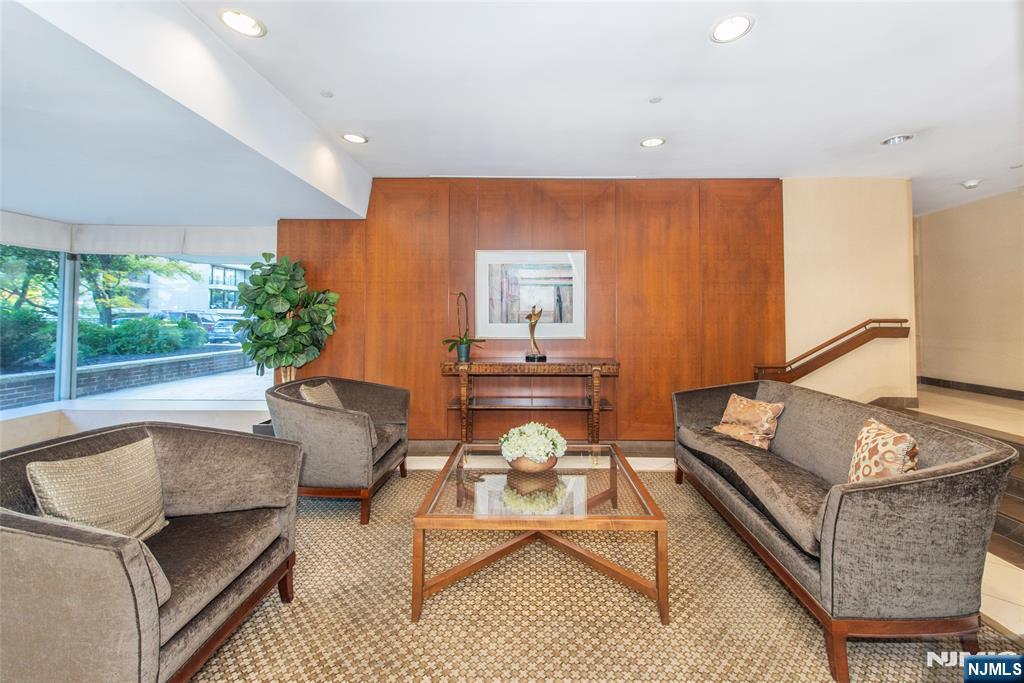 1 Horizon Road, Unit 403 Fort Lee, NJ 07024 - Photo 21 of 29 a living room with furniture and a large window