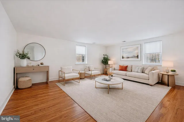 a bedroom with a bed and a potted plant