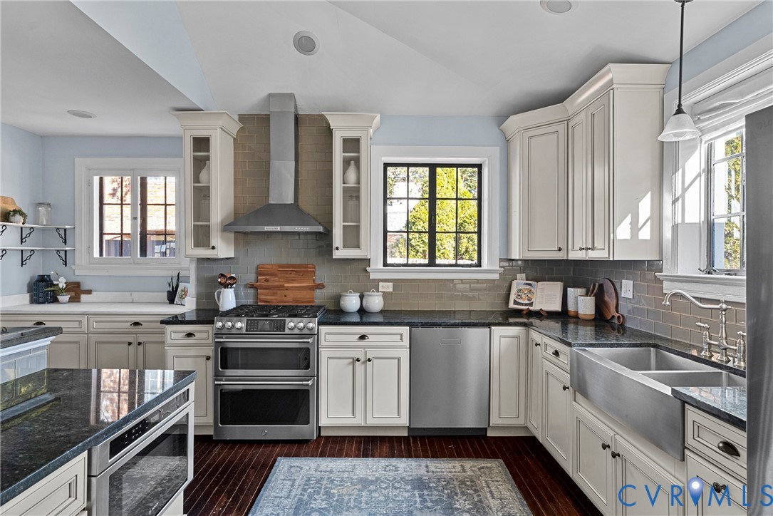 803 Spottswood Road Richmond, VA 23220 - Photo 13 of 50 a kitchen with stainless steel appliances granite countertop a stove a sink and a granite counter tops