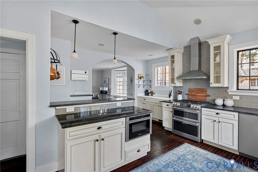 803 Spottswood Road Richmond, VA 23220 - Photo 14 of 50 a kitchen with stainless steel appliances granite countertop a stove and white cabinets