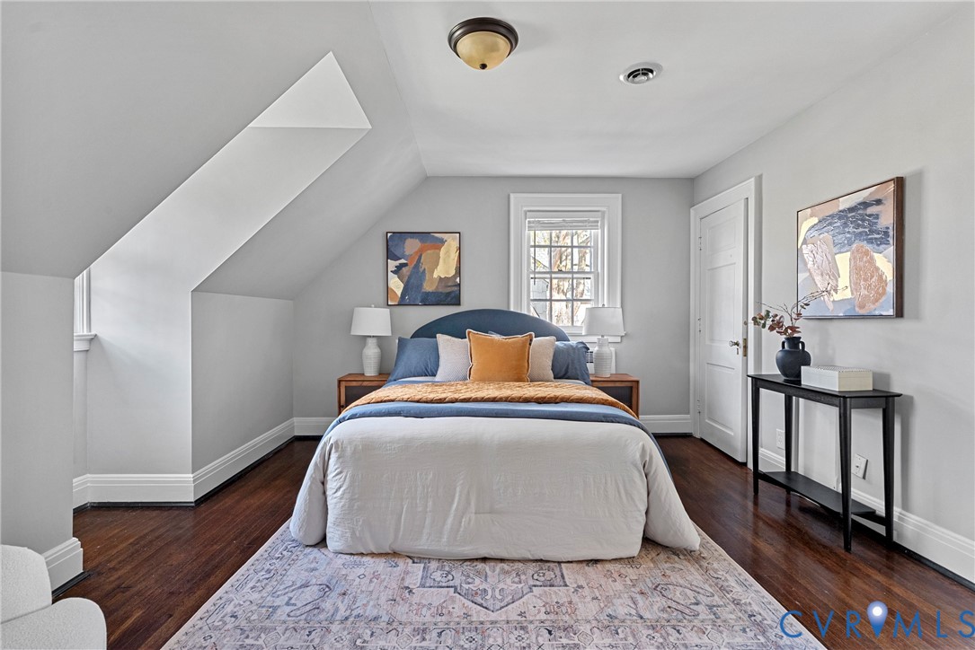 803 Spottswood Road Richmond, VA 23220 - Photo 21 of 50 a spacious bedroom with a bed and a window
