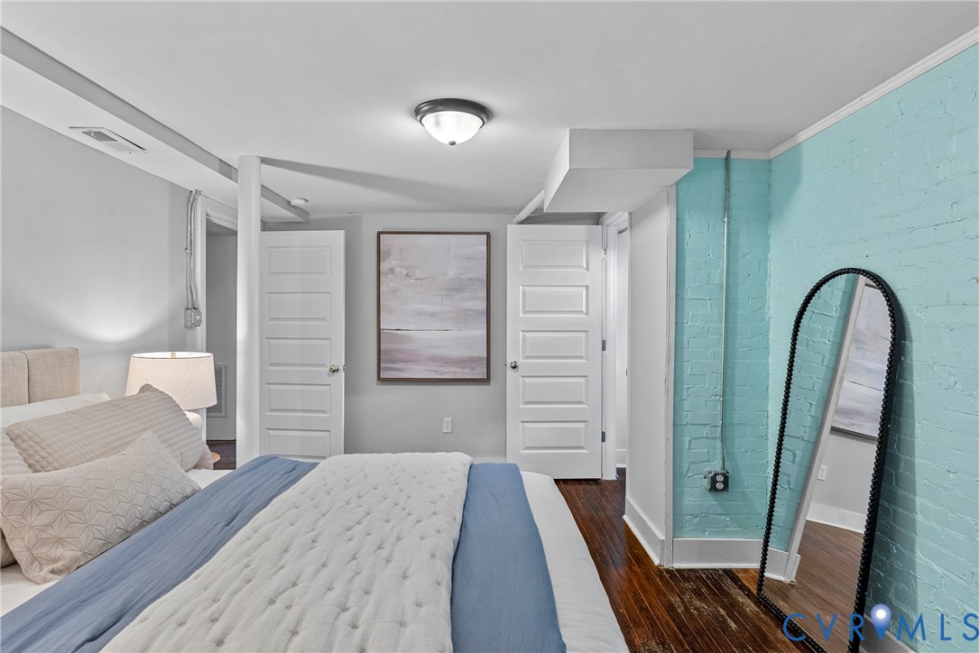 803 Spottswood Road Richmond, VA 23220 - Photo 30 of 50 a bedroom with a bed and a mirror